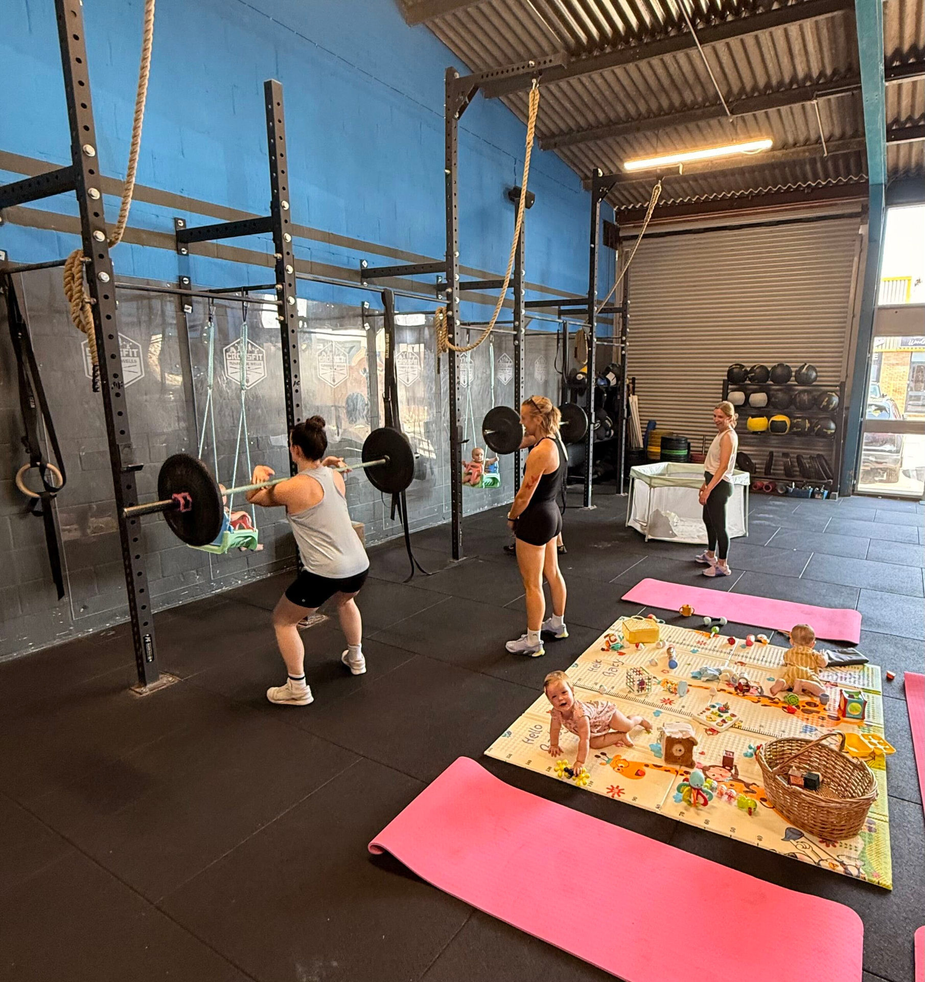 MumFit class with mums strength training while babies play safely nearby